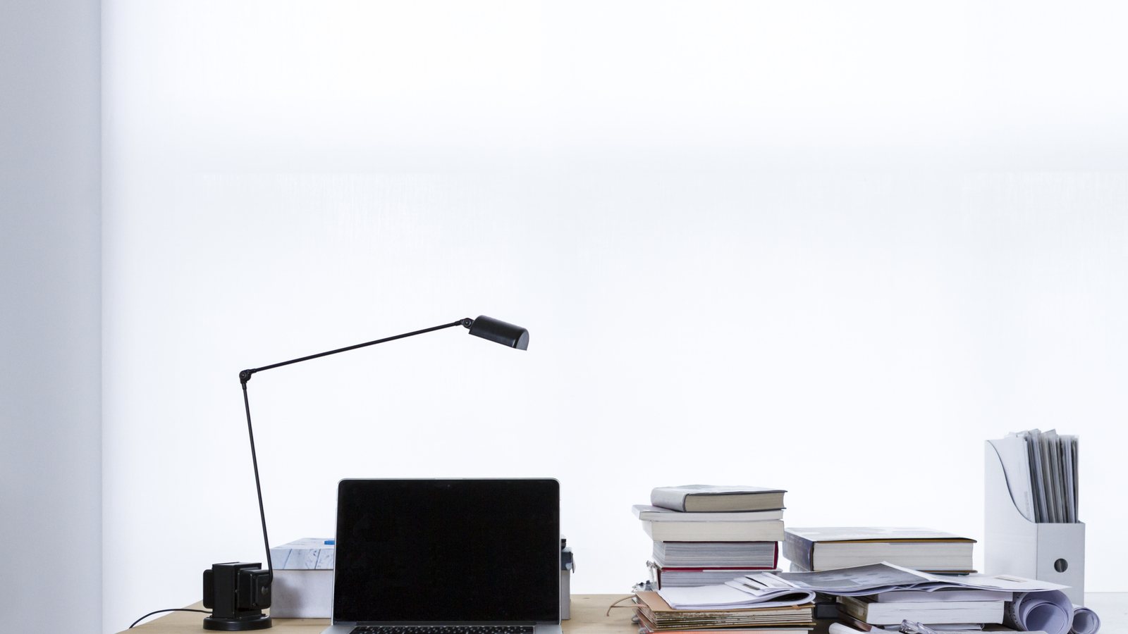 A laptop workspace representing shared AI agents, memory, and enterprise data paths